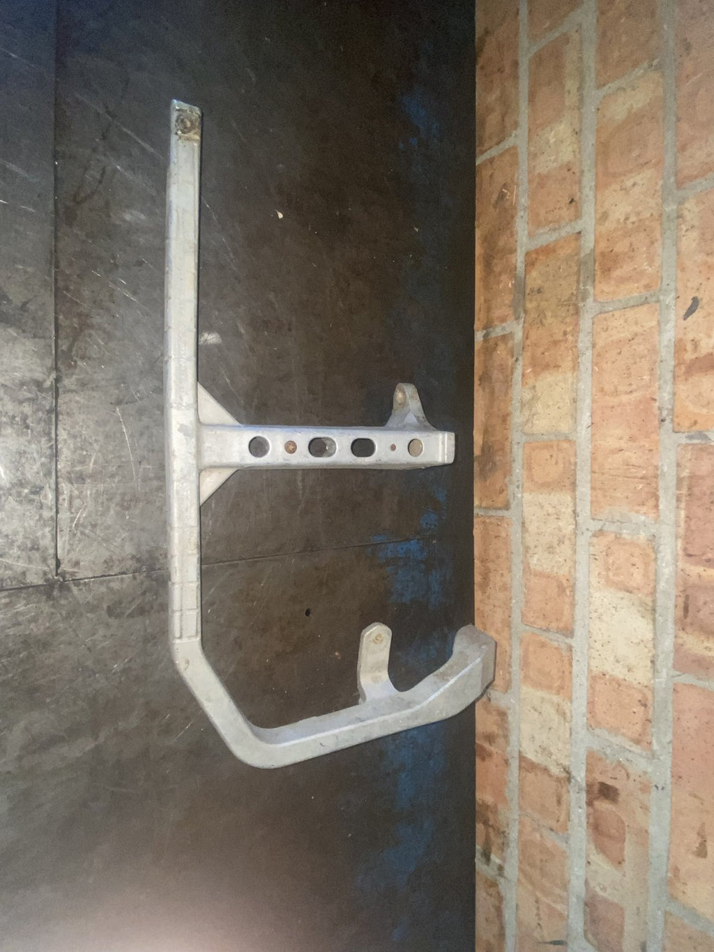 Used Suzuki KingQuad 500 right hand footrest bracket - side