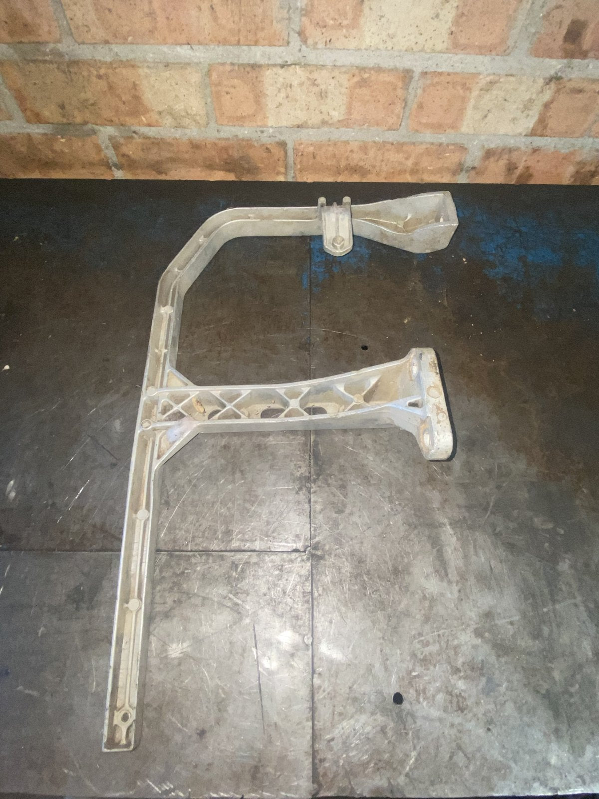 Used Suzuki KingQuad 500 right hand footrest bracket - underside